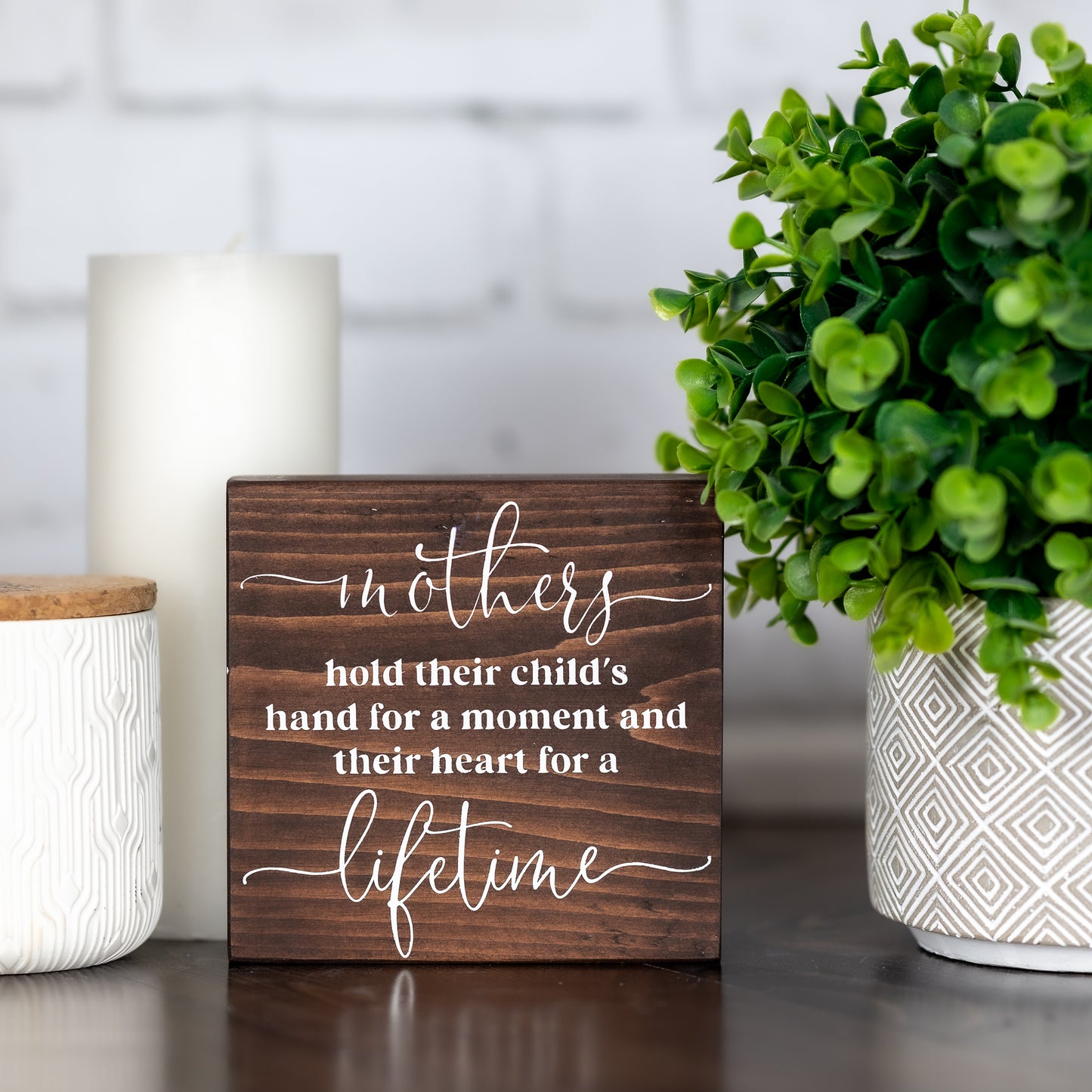 mothers hold their child's hand for a moment and their heart for a lifetime ~ block sign