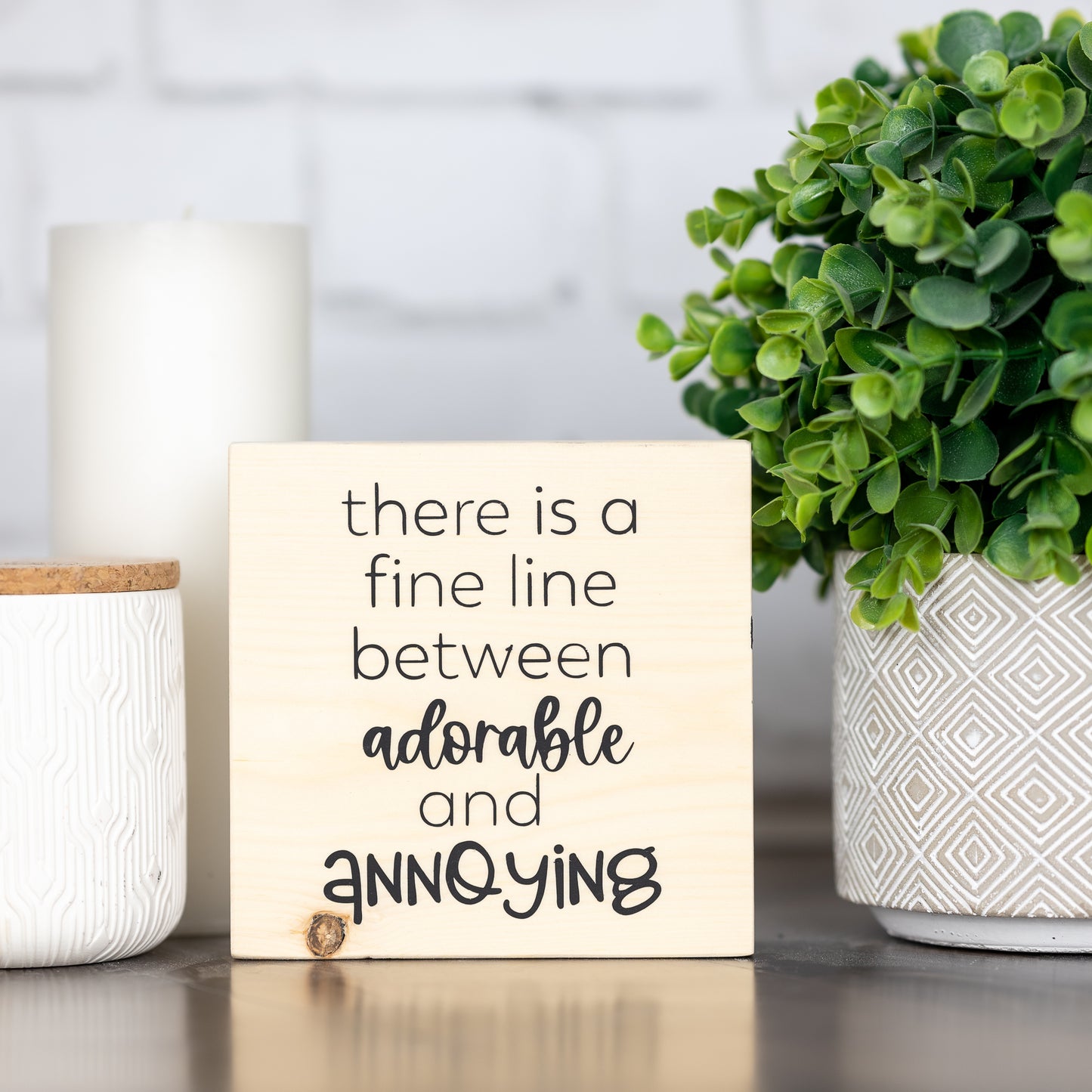 there is a fine line between adorable and annoying - block sign