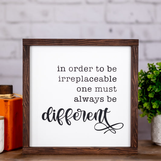 in order to be irreplaceable one must always be different ~ wood sign