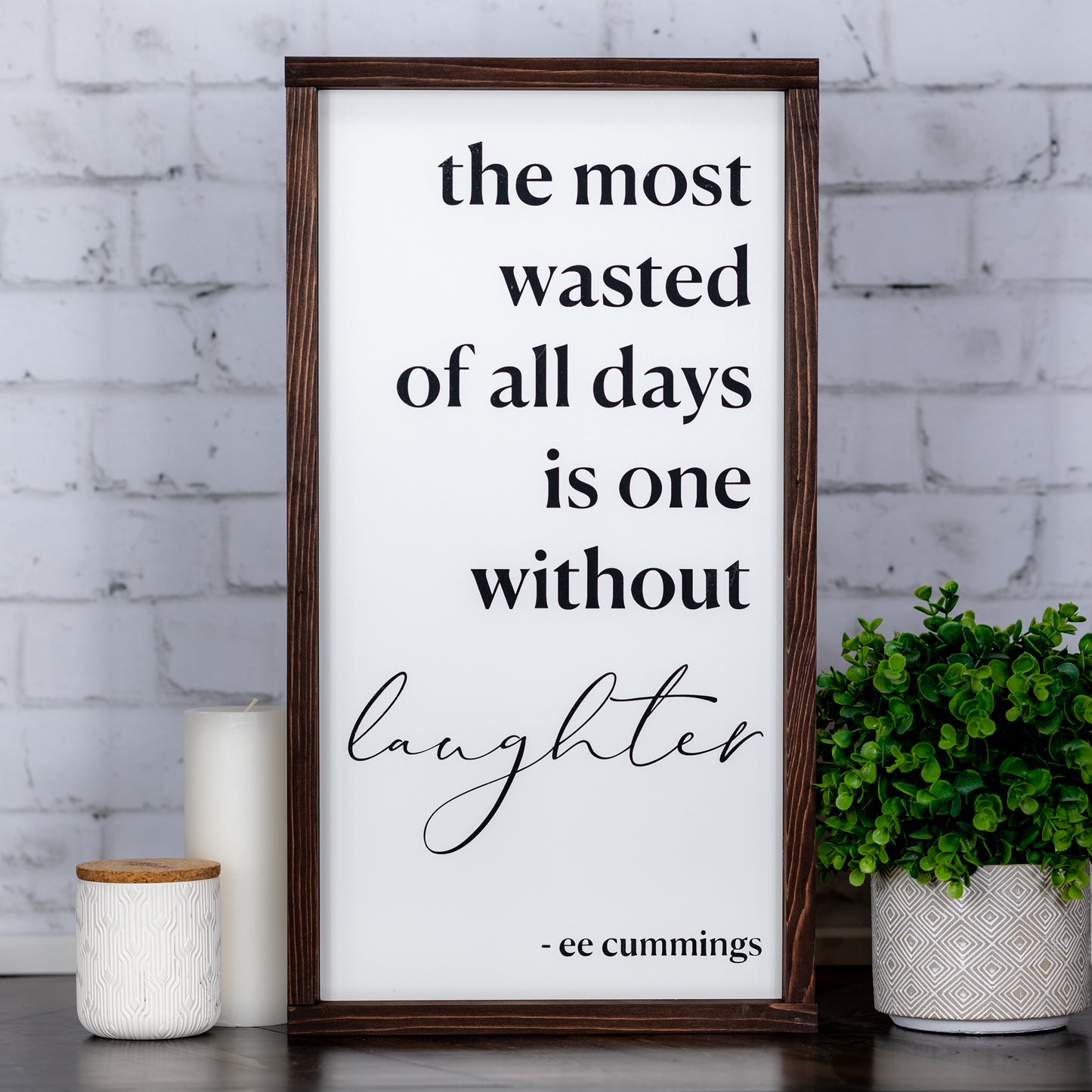 the most wasted of days is on without laughter ~ wood sign