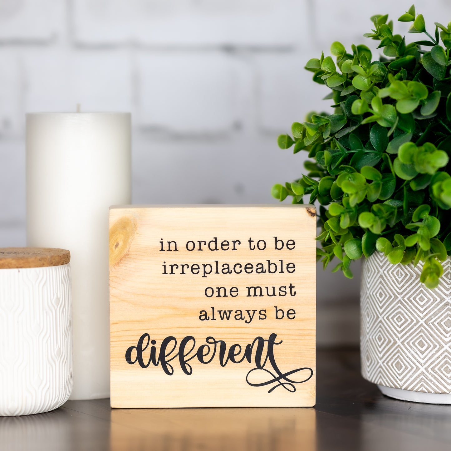 in order to be irreplaceable one must always be different ~ shelf block sign